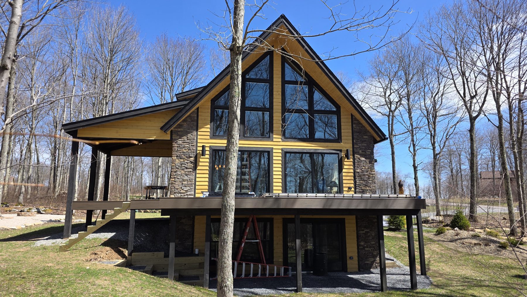 Rear exterior of Eagle's Perch with wraparound deck and large windows